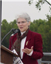 Woman giving a speech at the dedication